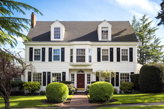 Three story suburban home with beautiful yard protected by Selective homeowners insurance