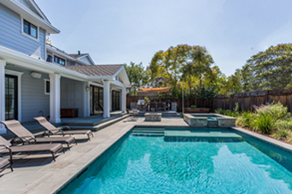 Large home with backyard pool protected by umbrella insurance from Selective