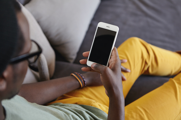 Client using their mobile phone to access Selective Insurance's mobile app